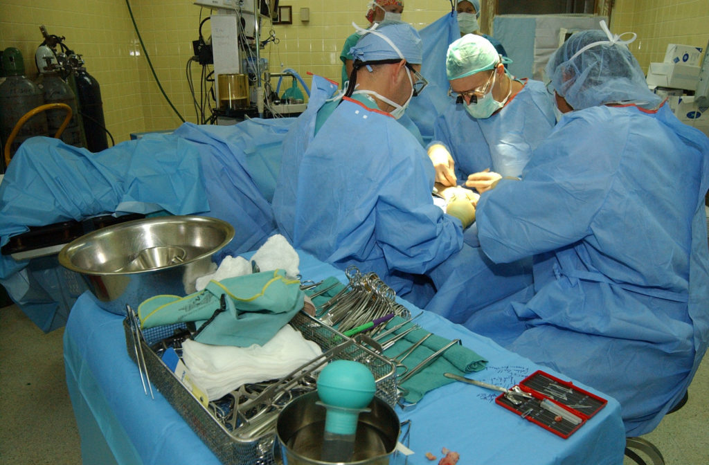 Surgeons in operating theatre