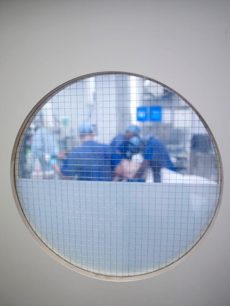 Image of operating theatre seen through window