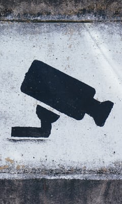 Street art image of a CCTV camera